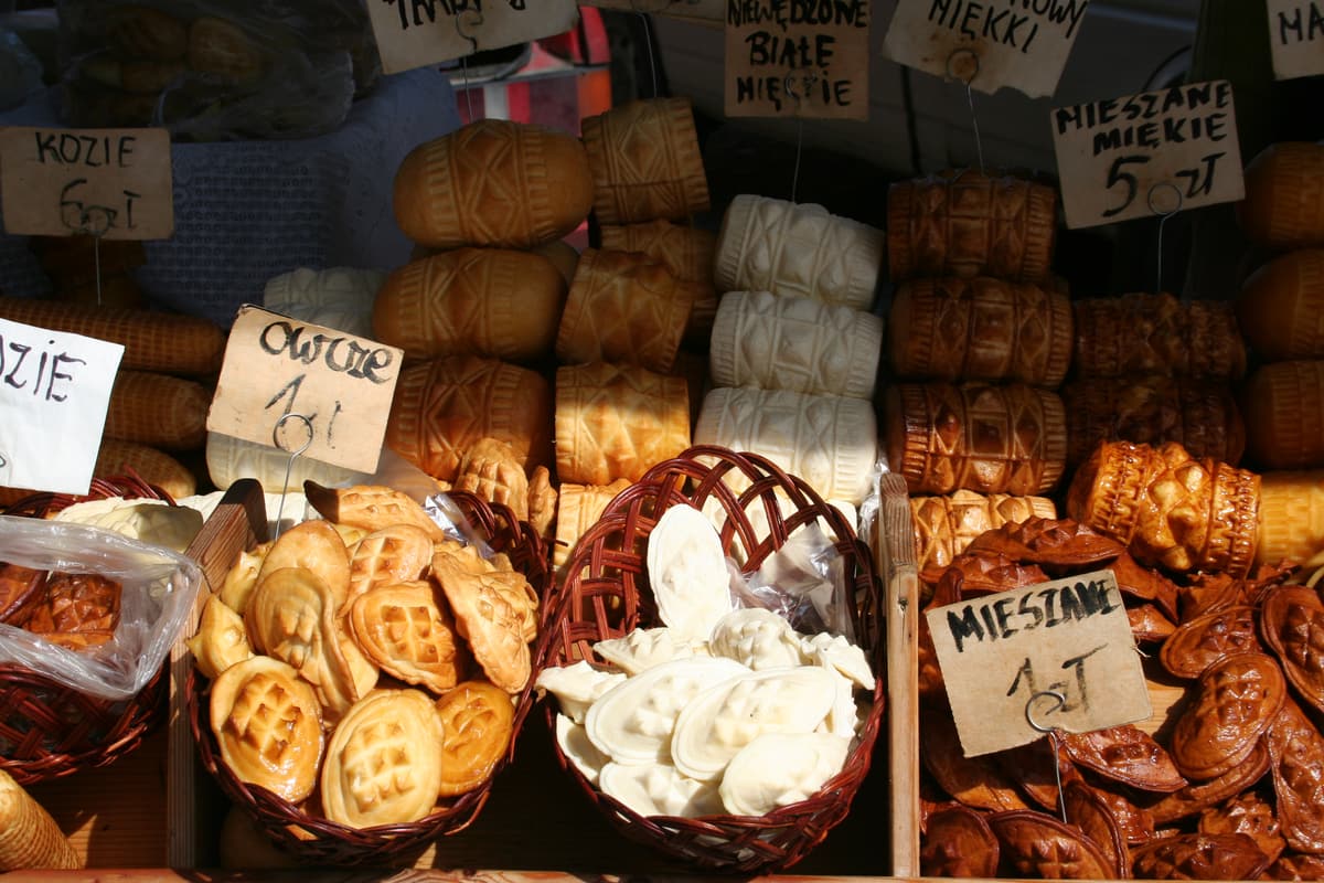 Oscypek smoked sheep’s cheeses stacked on a market stall in Zakopane